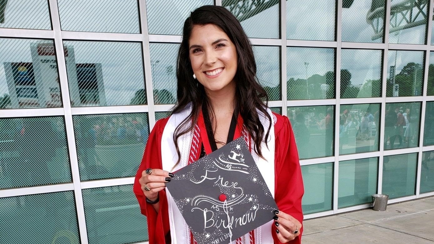 Claire Mangum pictured in NC State regalia outside of PNC Arena.