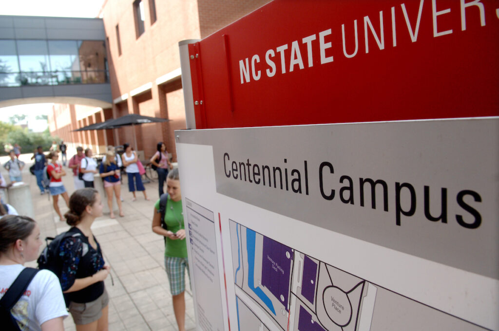 Students congregate and socialize in the courtyard outside of the Port City Java coffee shop on Centennial Campus.