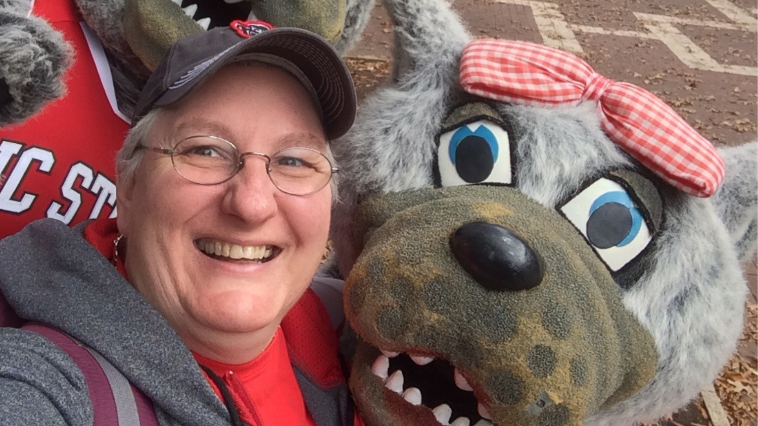 Maryann posing with NC State Mascot